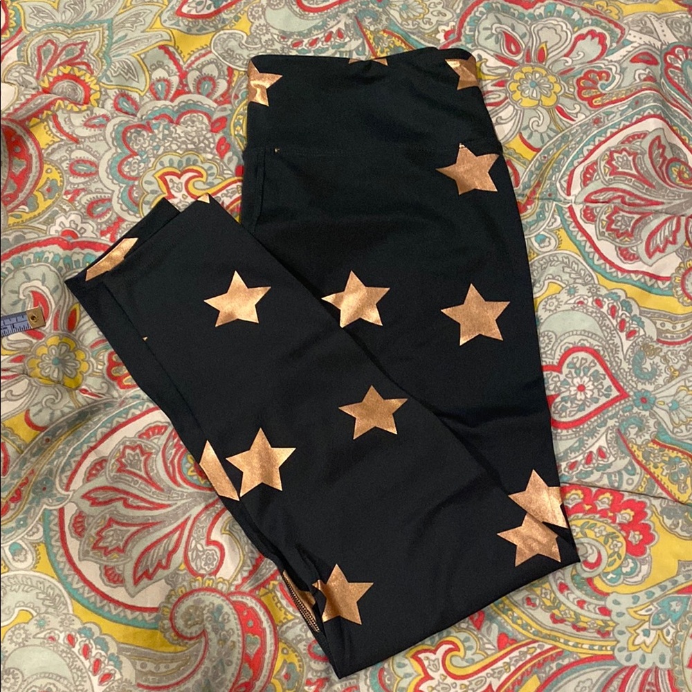NWT green leggings with gold stars. Large
